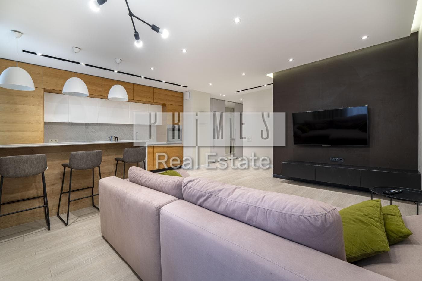 Kitchen-living room with a media wall